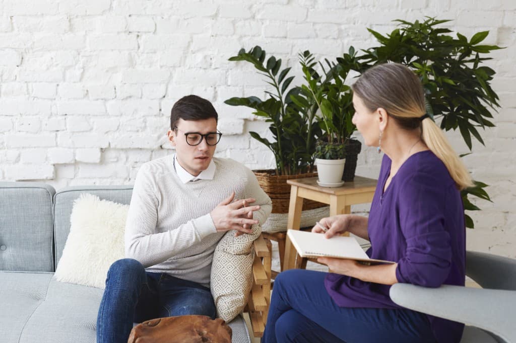 Client sharing openly during a calm, attentive therapy session